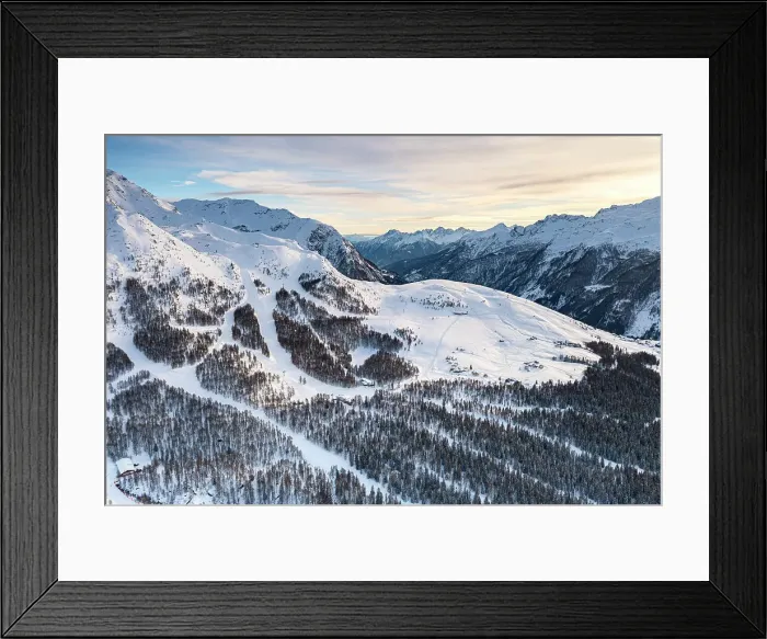 Framed Print : Aerial view of snowy ski slopes surrounded by frozen woods, Motta, Madesimo, Valle Spluga, Valtellina, Lombardy, Italy Framed Print : Aerial view of snowy ski slopes surrounded by frozen woods, Motta, Madesimo, Valle Spluga, Valtellina, Lombardy, Italy