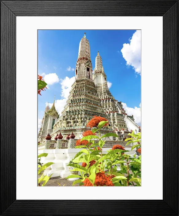 Framed Print : Majestic stupa tower of Wat Arun Buddhist temple framed by colorful flowers, Bangkok, Thailand Framed Print : Majestic stupa tower of Wat Arun Buddhist temple framed by colorful flowers, Bangkok, Thailand