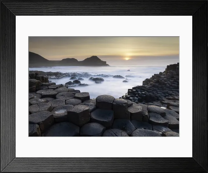 Framed Print : Sunset over the Giant's Causeway on the Causeway Coast, County Antrim, Northern Ireland. Spring (March) 2024