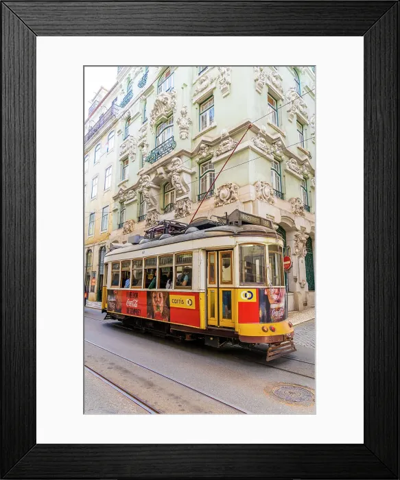 Framed Print : Tram passing a beautiful building in Lisbon, Portugal, Europe Framed Print : Tram passing a beautiful building in Lisbon, Portugal, Europe