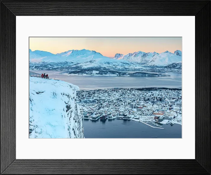 Framed Print : Tourists watching sunset over the frozen sea and snowy city of Tromso from Fjellheisen viewpoint on top of a mountain, Norway Framed Print : Tourists watching sunset over the frozen sea and snowy city of Tromso from Fjellheisen viewpoint on top of a mountain, Norway