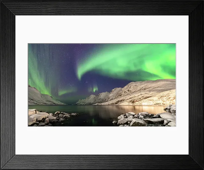 Framed Print : Bright night sky with Northern Lights over snowcapped mountains and frozen sea of Ersfjorden, Tromso, Norway
