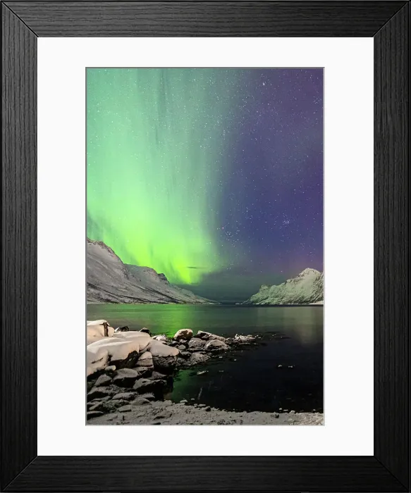 Framed Print : Snowy beach and mountains along Ersfjorden under a bright starry sky with Northern Lights, Tromso, Norway Framed Print : Snowy beach and mountains along Ersfjorden under a bright starry sky with Northern Lights, Tromso, Norway