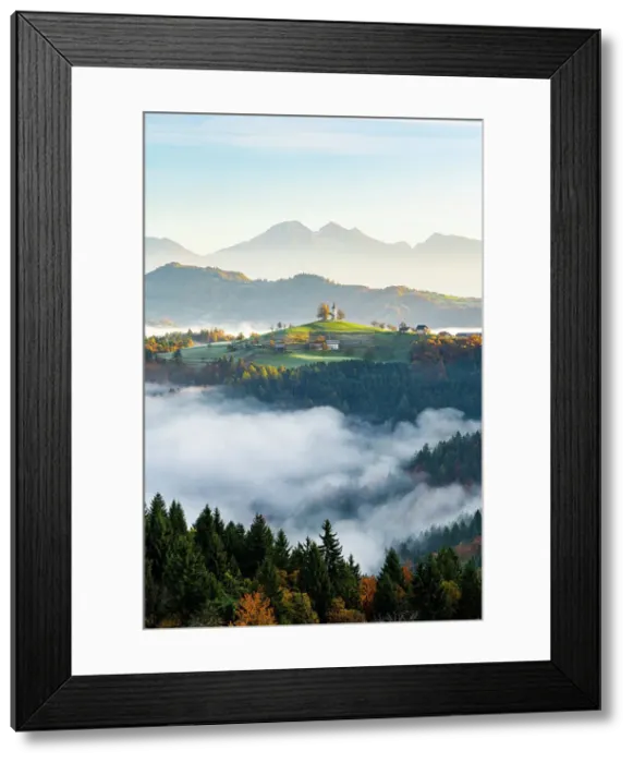 Framed Print : Church of St. Thomas and the Kamink Savinja Alps in winter, Skofja Loka, Slovenia