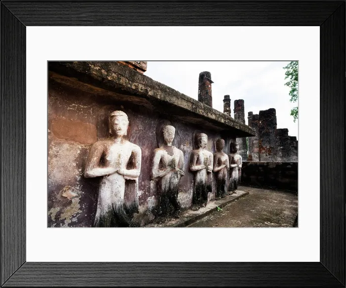 Framed Print : Buddha praying statues in a row in the old ruins of Wat Mahathat temple, Sukhothai Historical Park, Sukhothai, Thailand Framed Print : Buddha praying statues in a row in the old ruins of Wat Mahathat temple, Sukhothai Historical Park, Sukhothai, Thailand