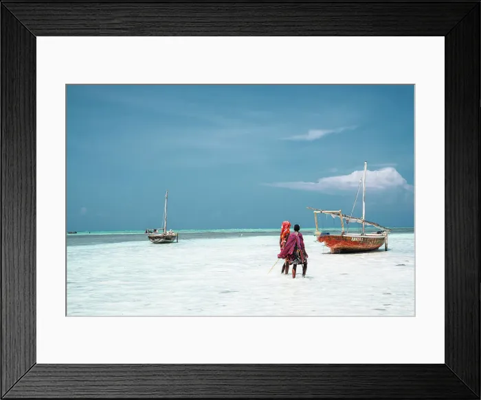 Framed Print : Boat and masai people on the shore at low tide, Nungwi, Zanzibar, Tanzania, Africa Framed Print : Boat and masai people on the shore at low tide, Nungwi, Zanzibar, Tanzania, Africa