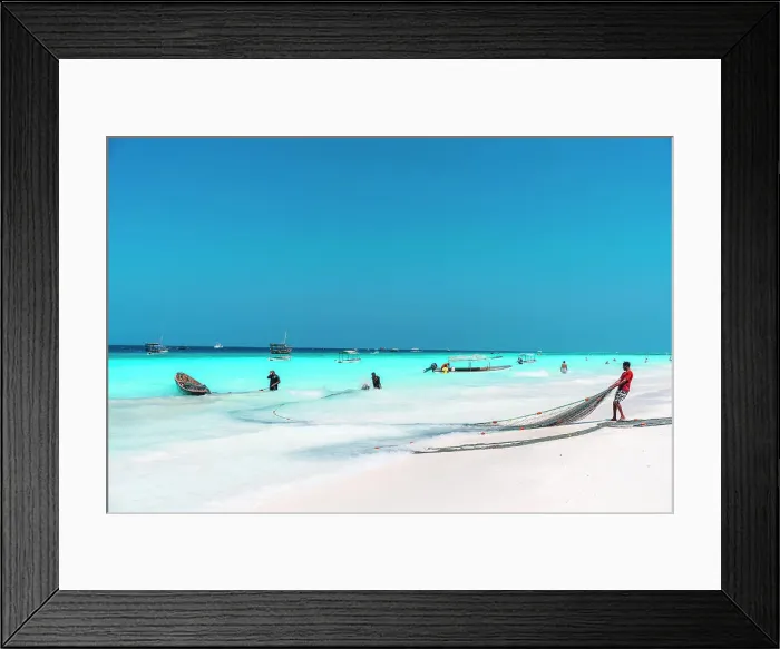 Framed Print : Fishermen haul their nets ashore after a fishing trip, Zanzibar, Tanzania, Africa Framed Print : Fishermen haul their nets ashore after a fishing trip, Zanzibar, Tanzania, Africa