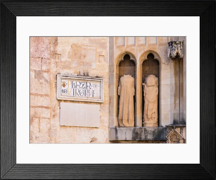 Framed Print : Facade details of La Catedral del Santo Caliz (Valencia Cathedral, or Cathedral of the Holy Chalice, or Saint Mary Cathedral) as seen from the Plaza de la Virgen (Virgin Square) in the old town of Valencia, Spain Framed Print : Facade details of La Catedral del Santo Caliz (Valencia Cathedral, or Cathedral of the Holy Chalice, or Saint Mary Cathedral) as seen from the Plaza de la Virgen (Virgin Square) in the old town of Valencia, Spain