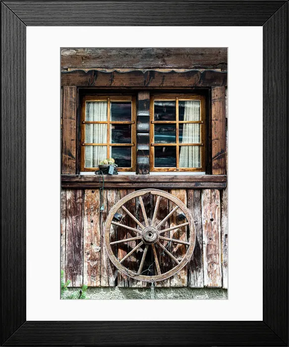 Framed Print : Wood facade of a mountain chalet decorated with an old wheel, Zermatt, canton of Valais, Switzerland Framed Print : Wood facade of a mountain chalet decorated with an old wheel, Zermatt, canton of Valais, Switzerland