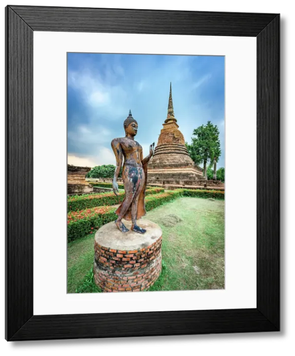 Framed Print : Main stupa and statue of the Walking Buddha in the green gardens of Wat Sa Si, Sukhothai Historical Park, Sukhothai, Thailand Framed Print : Main stupa and statue of the Walking Buddha in the green gardens of Wat Sa Si, Sukhothai Historical Park, Sukhothai, Thailand