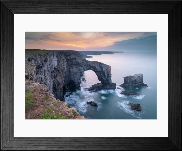 Framed Print : Colourful dawn sky above the Green Bridge of Wales natural arch in Pembrokeshire, Wales, UK. Spring (March) 2019 Framed Print : Colourful dawn sky above the Green Bridge of Wales natural arch in Pembrokeshire, Wales, UK. Spring (March) 2019