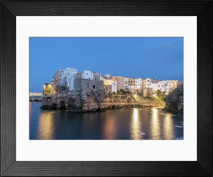 Framed Print : Illuminated fishing village of Polignano a Mare at dusk, Polignano a Mare, Bari province, Apulia, South of Italy, Italy, Europe Framed Print : Illuminated fishing village of Polignano a Mare at dusk, Polignano a Mare, Bari province, Apulia, South of Italy, Italy, Europe
