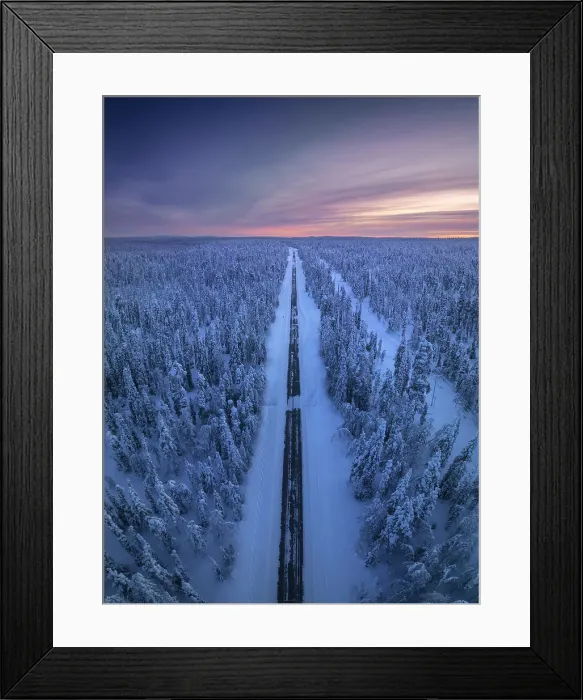 Framed Print : Aerial view of straight road during a winter evening in the Yllas-Pallastunturi National Park, Lapland, Finland Framed Print : Aerial view of straight road during a winter evening in the Yllas-Pallastunturi National Park, Lapland, Finland