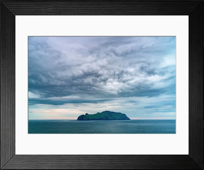 Framed Print : Storm clouds over Mykines island in the middle of the blue Atlantic ocean at dusk, Faroe Islands, Denmark Framed Print : Storm clouds over Mykines island in the middle of the blue Atlantic ocean at dusk, Faroe Islands, Denmark