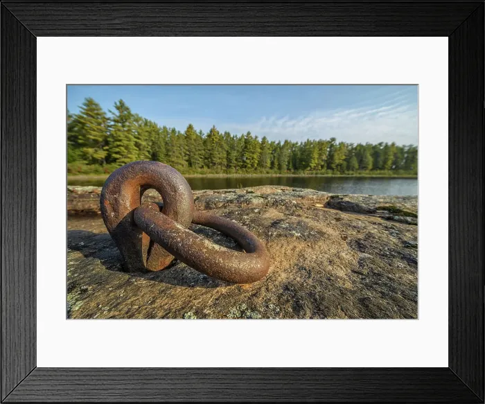 Framed Print : A steel ringlet from the logging days of the late 1800s remains embedded in the Canadian Shield on Lake Travers in Algonquin Provincial Park, Ontario, Canada Framed Print : A steel ringlet from the logging days of the late 1800s remains embedded in the Canadian Shield on Lake Travers in Algonquin Provincial Park, Ontario, Canada