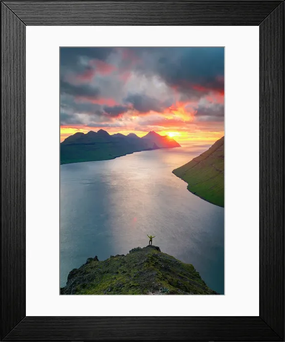 Framed Print : High angle view of a man silhouette rejoicing on Klakkur mountain looking at sea at sunset, Klaksvik, Bordoy island, Faroe Islands Framed Print : High angle view of a man silhouette rejoicing on Klakkur mountain looking at sea at sunset, Klaksvik, Bordoy island, Faroe Islands