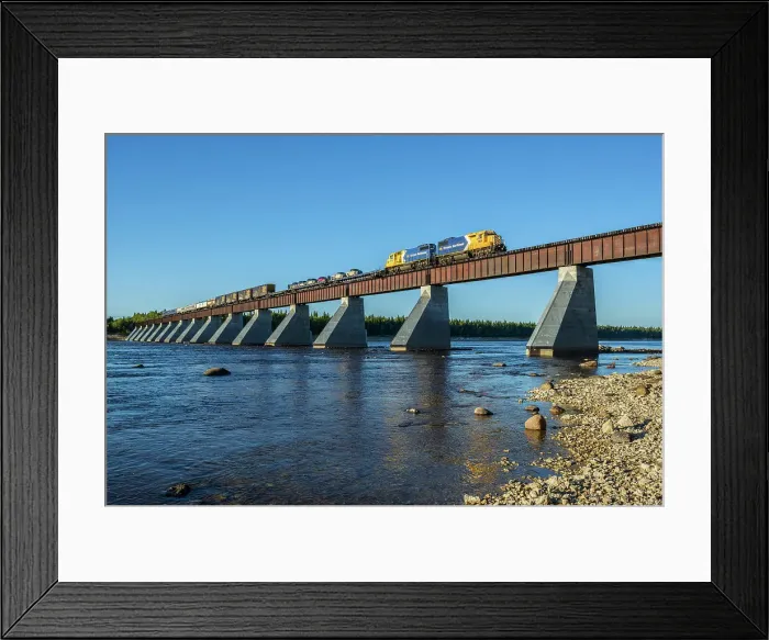 Framed Print : Ontario Northland train crossing the Moose River Bridge in the James Bay Lowlands, Ontario, Canada Framed Print : Ontario Northland train crossing the Moose River Bridge in the James Bay Lowlands, Ontario, Canada