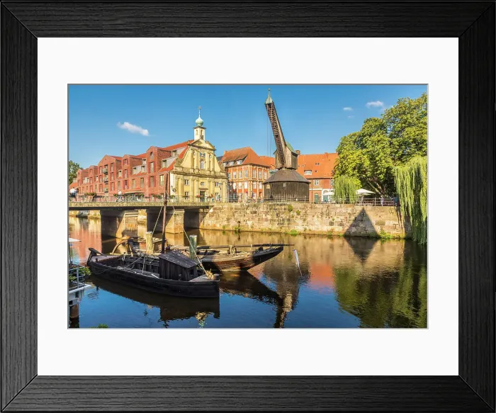 Framed Print : Old harbor on the Ilmenau, in the background old crane and old department store, Luneburg, Lower Saxony, Germany Framed Print : Old harbor on the Ilmenau, in the background old crane and old department store, Luneburg, Lower Saxony, Germany