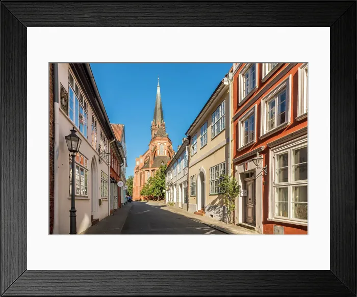 Framed Print : Old town street with St. Nicolai church, Luneburg, Lower Saxony, Germany Framed Print : Old town street with St. Nicolai church, Luneburg, Lower Saxony, Germany