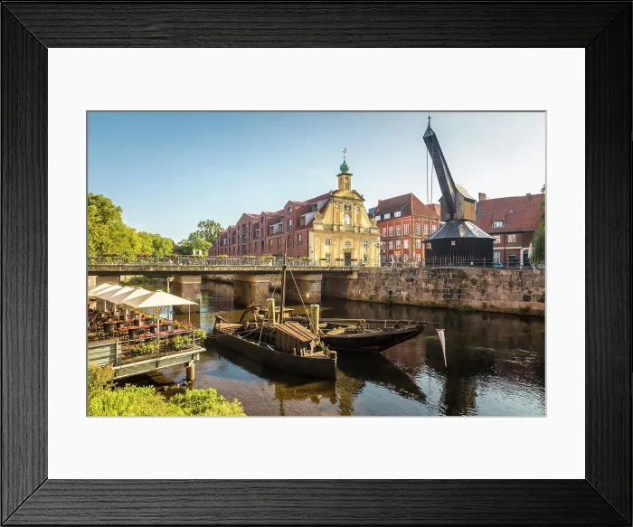 Framed Print : Old barges on the Ilmenau with old department store, Luneburg, Lower Saxony, Germany Framed Print : Old barges on the Ilmenau with old department store, Luneburg, Lower Saxony, Germany