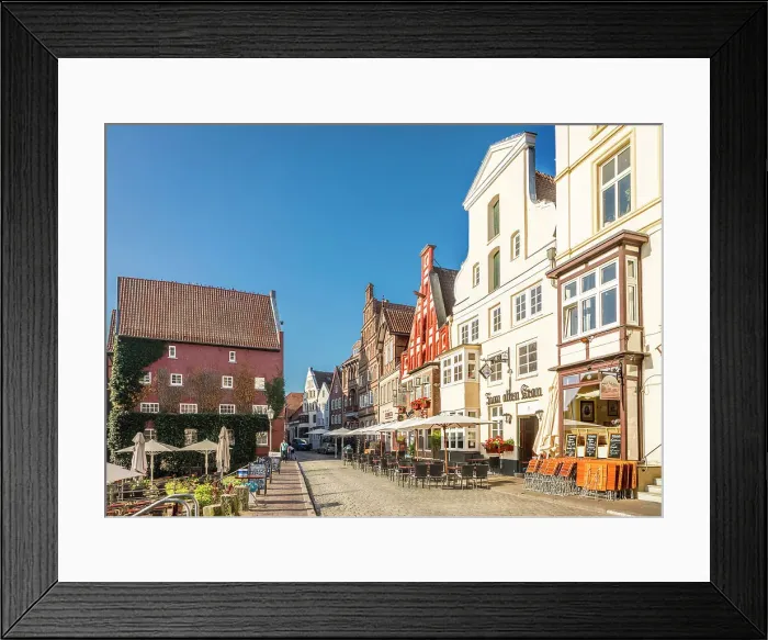 Framed Print : Row of houses at Am Stintmarkt with outdoor terraces, Luneburg, Lower Saxony, Germany