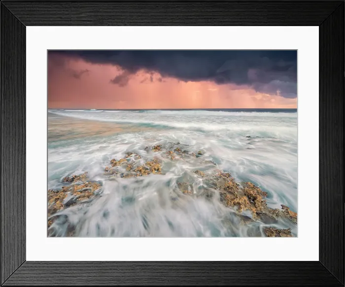 Framed Print : Storm clouds at daybreak on the Caribbean Sea along the rugged ironshore of Grand Cayman in the Cayman Islands, British West Indies Framed Print : Storm clouds at daybreak on the Caribbean Sea along the rugged ironshore of Grand Cayman in the Cayman Islands, British West Indies