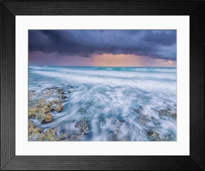 Framed Print : Storm clouds at daybreak on the Caribbean Sea along the rugged ironshore of Grand Cayman in the Cayman Islands, British West Indies Framed Print : Storm clouds at daybreak on the Caribbean Sea along the rugged ironshore of Grand Cayman in the Cayman Islands, British West Indies