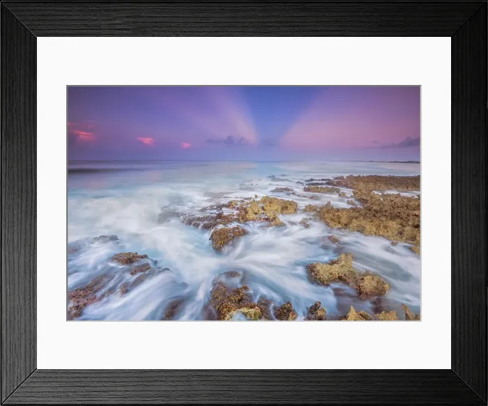 Framed Print : Daybreak on the Caribbean Sea along the rugged ironshore of Grand Cayman in the Cayman Islands, British West Indies