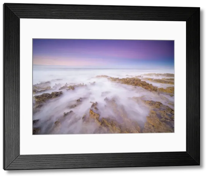 Framed Print : Daybreak on the Caribbean Sea along the rugged ironshore of Grand Cayman in the Cayman Islands, British West Indies Framed Print : Daybreak on the Caribbean Sea along the rugged ironshore of Grand Cayman in the Cayman Islands, British West Indies