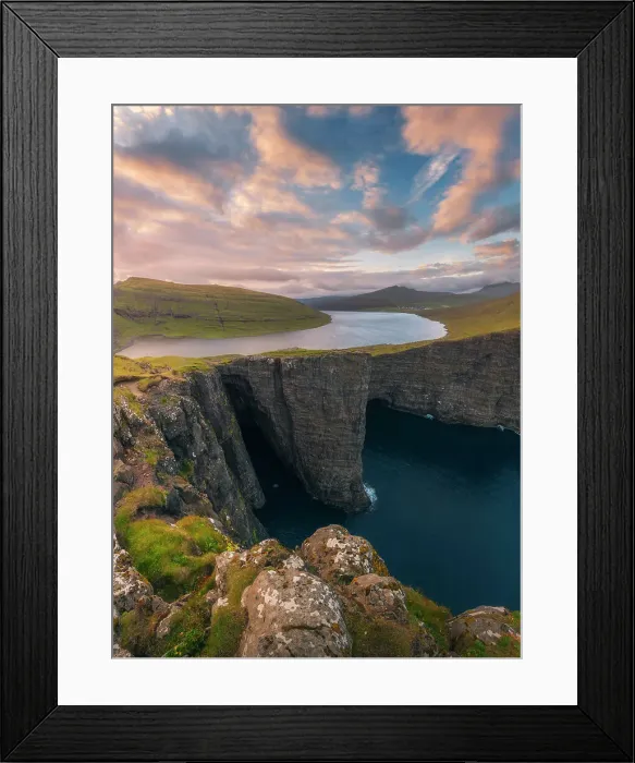 Framed Print : An explosive sunset during a summer evening at the lake above the ocean (Sorvagsvatn), in the Faroe Islands Framed Print : An explosive sunset during a summer evening at the lake above the ocean (Sorvagsvatn), in the Faroe Islands