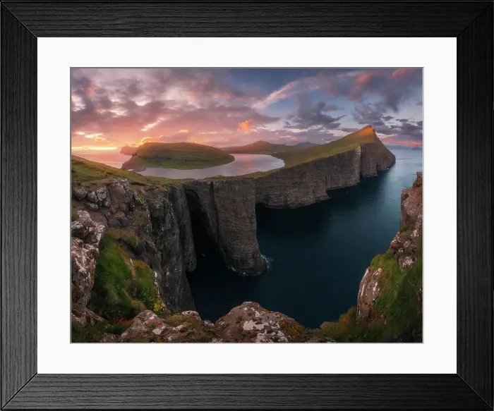Framed Print : An explosive sunset during a summer evening at the lake above the ocean (Sorvagsvatn), in the Faroe Islands Framed Print : An explosive sunset during a summer evening at the lake above the ocean (Sorvagsvatn), in the Faroe Islands