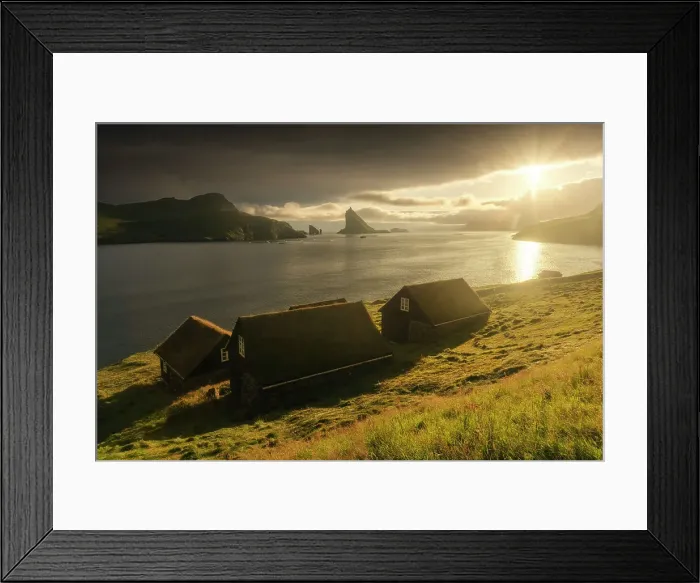 Framed Print : Some moss-covered houses with Drangarnir and Tindholmur sea stacks in the background. Vagar, Faroe Islands Framed Print : Some moss-covered houses with Drangarnir and Tindholmur sea stacks in the background. Vagar, Faroe Islands