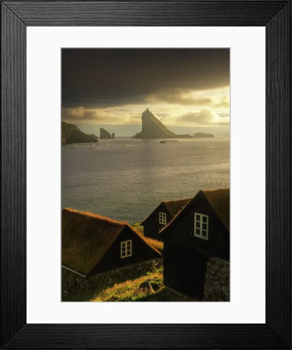 Framed Print : Some moss-covered houses with Drangarnir and Tindholmur sea stacks in the background. Vagar, Faroe Islands Framed Print : Some moss-covered houses with Drangarnir and Tindholmur sea stacks in the background. Vagar, Faroe Islands