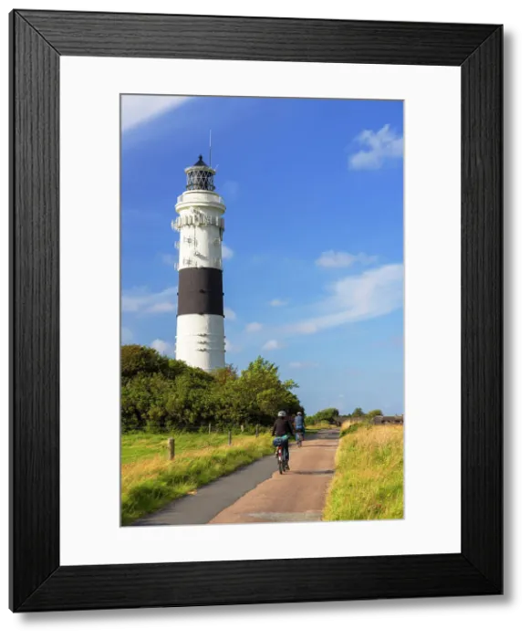 Framed Print : Cyclists passing Langer Christian lighthouse, Kampen, Sylt, Schleswig Holstein, Germany Framed Print : Cyclists passing Langer Christian lighthouse, Kampen, Sylt, Schleswig Holstein, Germany