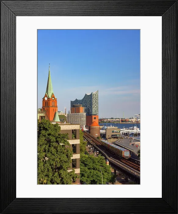Framed Print : U-Bahn train on tracks with Elbephilharmonie in background, Hamburg, Germany Framed Print : U-Bahn train on tracks with Elbephilharmonie in background, Hamburg, Germany