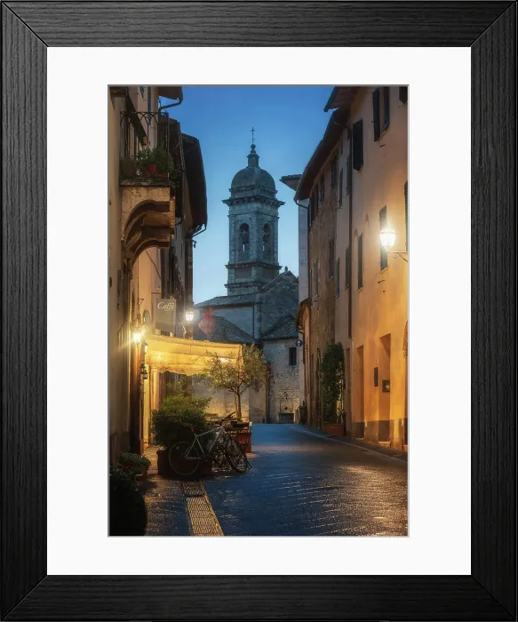 Framed Print : Twilight street view of San Quirico d'Orcia during a rainy winter evening in Val d'Orcia, Tuscany, Italy Framed Print : Twilight street view of San Quirico d'Orcia during a rainy winter evening in Val d'Orcia, Tuscany, Italy