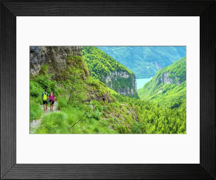 Framed Print : Europe, Italy, Trentino. A couple of hikers on the mountain path above the Lake of Molveno in the Brenta Dolomites Framed Print : Europe, Italy, Trentino. A couple of hikers on the mountain path above the Lake of Molveno in the Brenta Dolomites