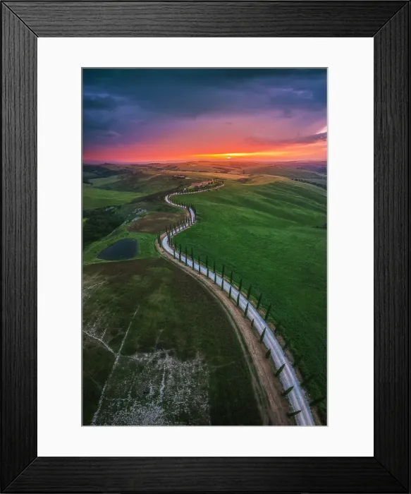 Framed Print : Sunset over the winding road of the Podere Baccoleno in the Crete Senesi, Tuscany, Italy Framed Print : Sunset over the winding road of the Podere Baccoleno in the Crete Senesi, Tuscany, Italy