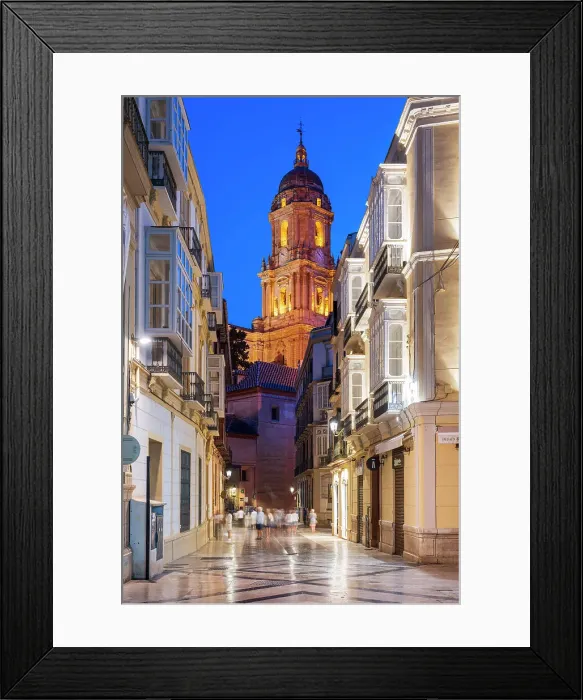 Framed Print : Scenic night view of a street in the old town with cathedral's bell tower in the background, Malaga, Andalusia, Spain Framed Print : Scenic night view of a street in the old town with cathedral's bell tower in the background, Malaga, Andalusia, Spain