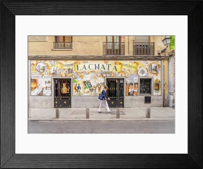 Framed Print : A woman walking past La Chata Restaurant, Madrid, Spain Framed Print : A woman walking past La Chata Restaurant, Madrid, Spain