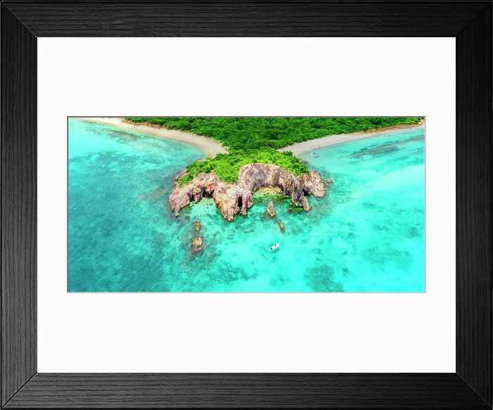 Framed Print : Aerial view of a tourist on a boat moored in the blue lagoon surrounding the green headland of Pearns Point, Antigua, Caribbean Framed Print : Aerial view of a tourist on a boat moored in the blue lagoon surrounding the green headland of Pearns Point, Antigua, Caribbean