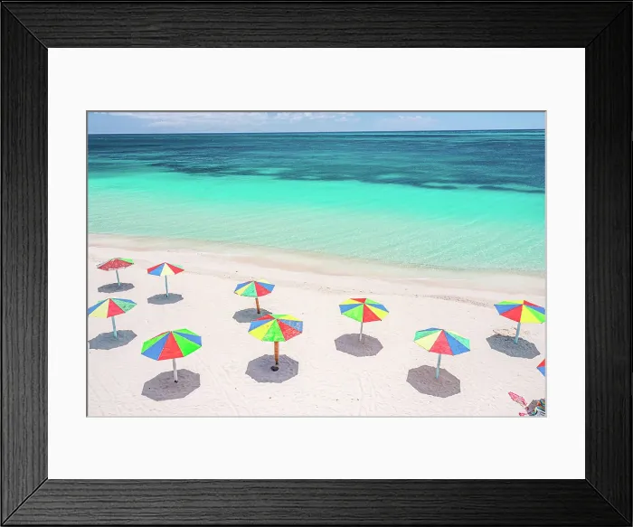 Framed Print : Aerial view of colorful beach umbrellas of a tourist resort on a beach washed by Caribbean Sea, Antigua, Antigua & Barbuda Framed Print : Aerial view of colorful beach umbrellas of a tourist resort on a beach washed by Caribbean Sea, Antigua, Antigua & Barbuda