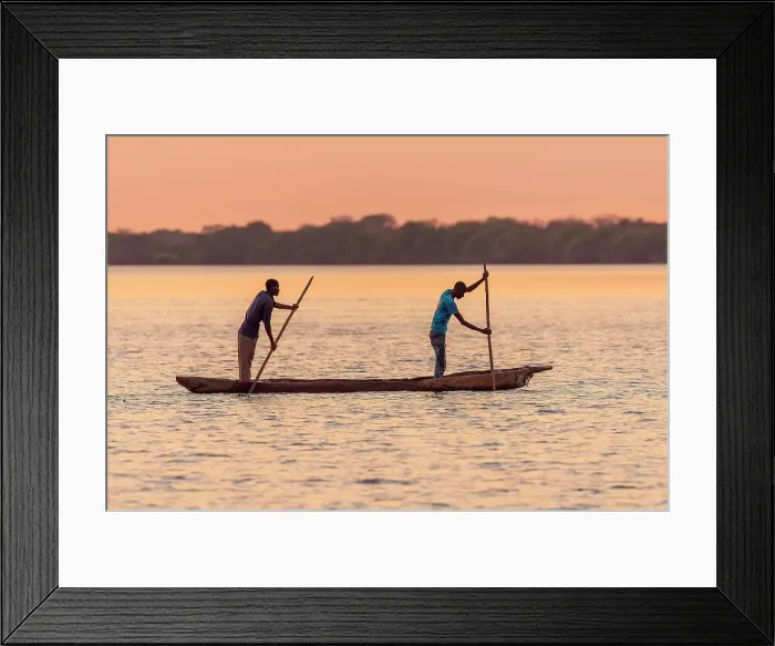 Framed Print : Africa, Botswana, Chobe River. Two Fishermen with traditional mokoro canoe on the river at sunset