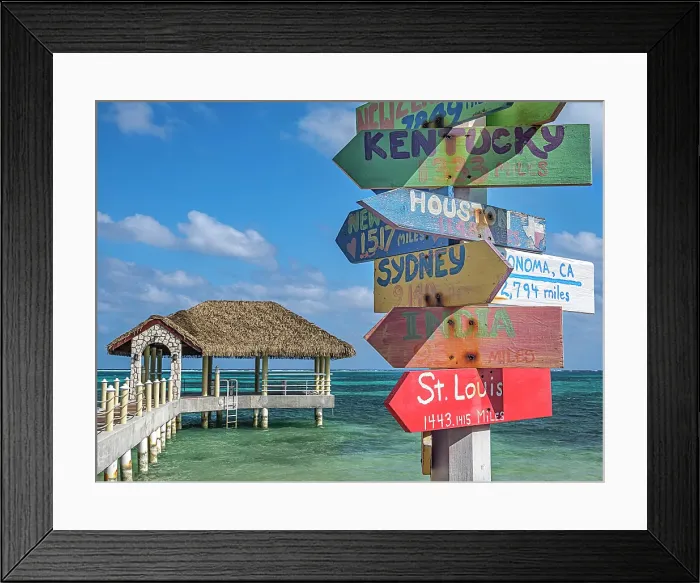 Framed Print : Fun directional sign post along the Caribbean Sea on Grand Cayman, Cayman Islands, British West Indies Framed Print : Fun directional sign post along the Caribbean Sea on Grand Cayman, Cayman Islands, British West Indies
