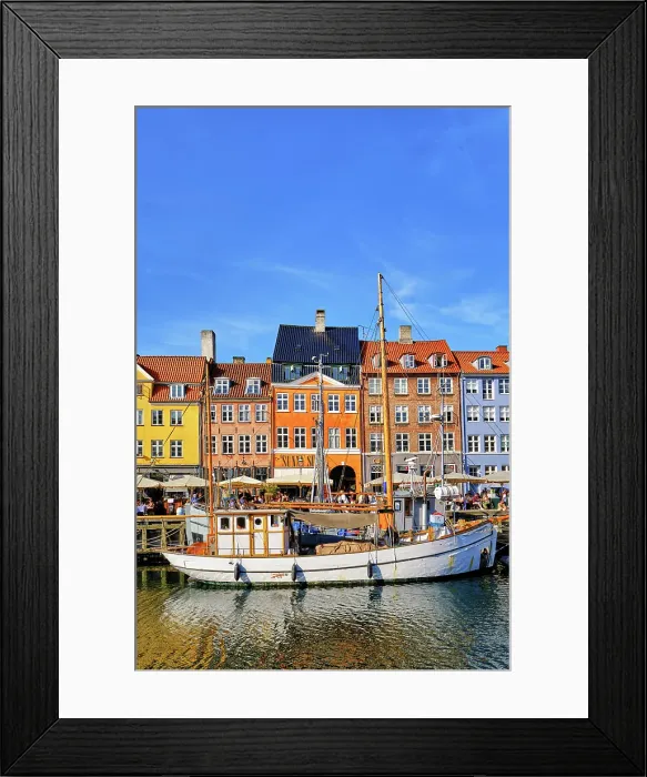 Framed Print : Nyhavn, or New Harbour, is a 17th-century waterfront, canal and entertainment district, full of restaurants and bars, in Copenhagen, Denmark Framed Print : Nyhavn, or New Harbour, is a 17th-century waterfront, canal and entertainment district, full of restaurants and bars, in Copenhagen, Denmark