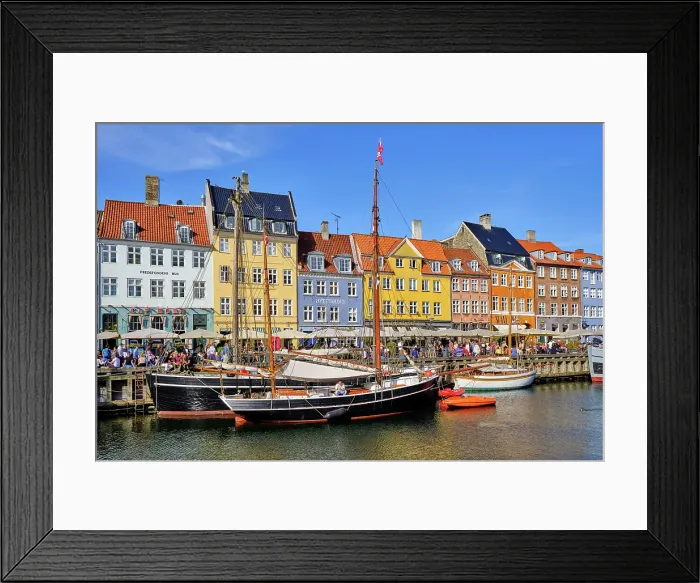 Framed Print : Nyhavn, or New Harbour, is a 17th-century waterfront, canal and entertainment district, full of restaurants and bars, in Copenhagen, Denmark Framed Print : Nyhavn, or New Harbour, is a 17th-century waterfront, canal and entertainment district, full of restaurants and bars, in Copenhagen, Denmark