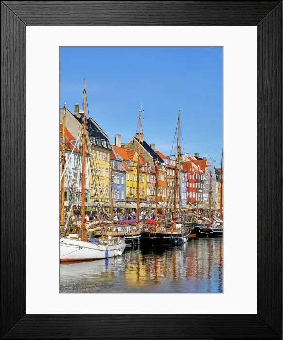 Framed Print : Nyhavn, or New Harbour, is a 17th-century waterfront, canal and entertainment district, full of restaurants and bars, in Copenhagen, Denmark Framed Print : Nyhavn, or New Harbour, is a 17th-century waterfront, canal and entertainment district, full of restaurants and bars, in Copenhagen, Denmark