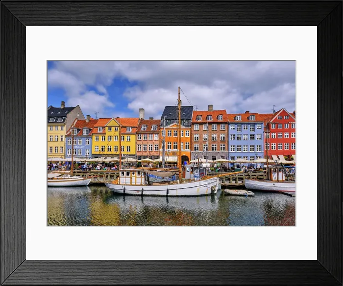 Framed Print : Nyhavn, or New Harbour, is a 17th-century waterfront, canal and entertainment district, full of restaurants and bars, in Copenhagen, Denmark Framed Print : Nyhavn, or New Harbour, is a 17th-century waterfront, canal and entertainment district, full of restaurants and bars, in Copenhagen, Denmark