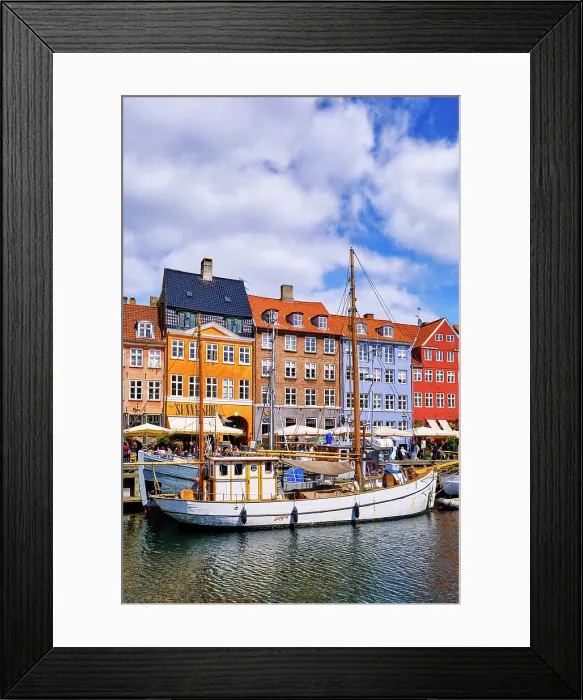 Framed Print : Nyhavn, or New Harbour, is a 17th-century waterfront, canal and entertainment district, full of restaurants and bars, in Copenhagen, Denmark Framed Print : Nyhavn, or New Harbour, is a 17th-century waterfront, canal and entertainment district, full of restaurants and bars, in Copenhagen, Denmark
