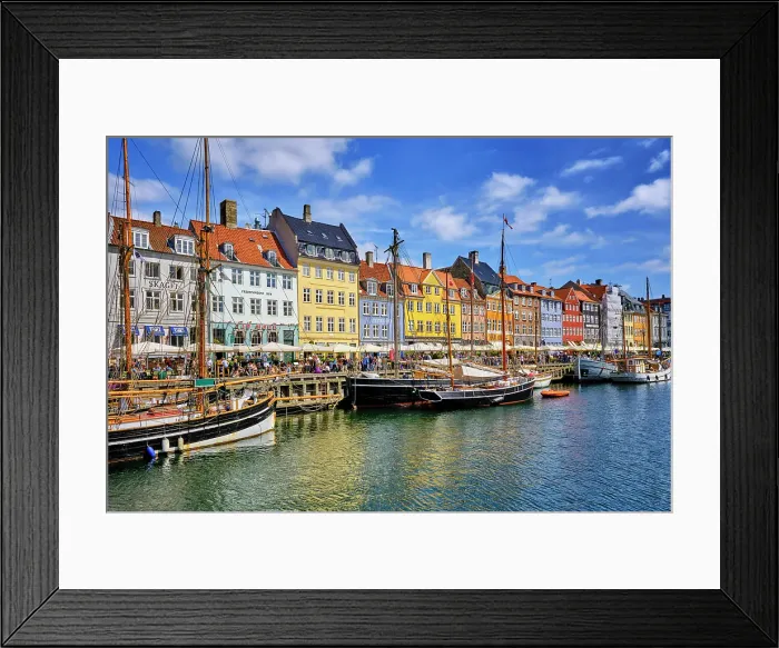 Framed Print : Nyhavn, or New Harbour, is a 17th-century waterfront, canal and entertainment district, full of restaurants and bars, in Copenhagen, Denmark